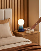 Pebble Stack Ceramic Nightstand Lamp — blue lifestyle arm
