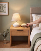Aria White Ceramic Nightstand Lamp — lifestyle arm