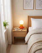Pebble Stack Ceramic Nightstand Lamp — orange right angle