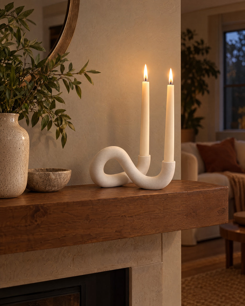 White: Knot Sculptural Double Candle Holder styled in a warm interior at dusk