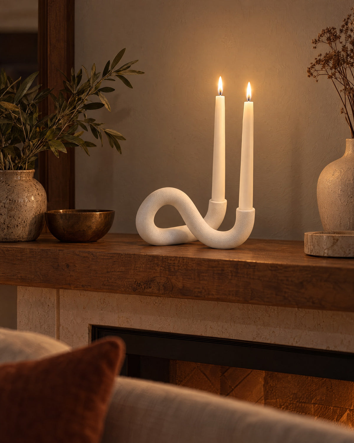 White: Knot Sculptural Double Candle Holder, lit, in a lived-in evening scene