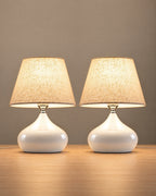Aria White Ceramic Nightstand Lamp, Set of 2, both lamps switched on