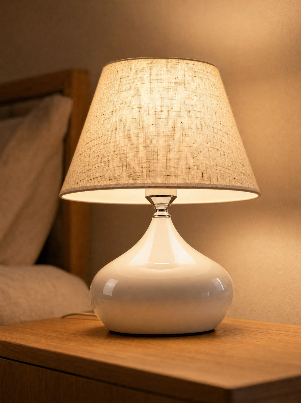 Aria White Ceramic Nightstand Lamp, close-up, lit
