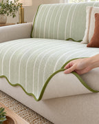 Sage Stripe: Corner lifted to show the non-slip backing of the Aurivelle Herringbone Scallop Edge Sofa Cover