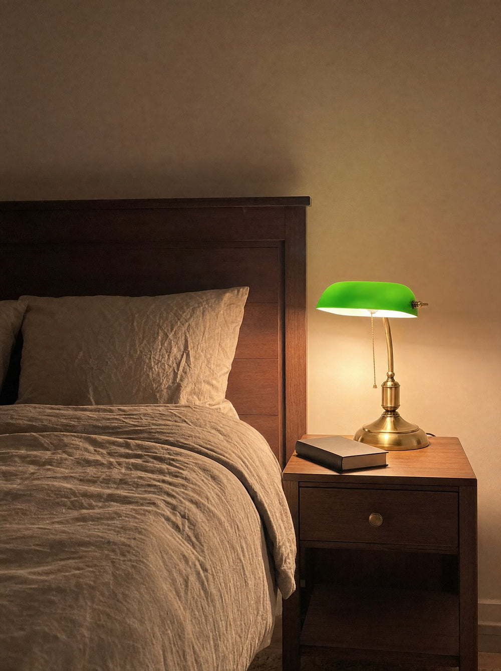 Bankers Green Glass Nightstand Lamp, at night on a nightstand
