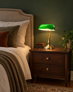 Bankers Green Glass Nightstand Lamp in a styled bedroom at dusk