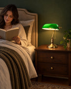 Bankers Green Glass Nightstand Lamp as a reading light beside a woman reading in bed