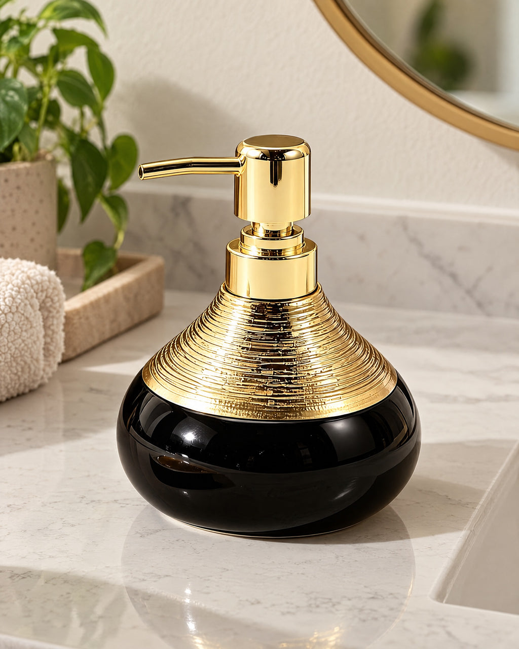 Soap Dispenser, Ceramic, Black with Brushed Gold, 9 oz on a bathroom vanity in soft daylight