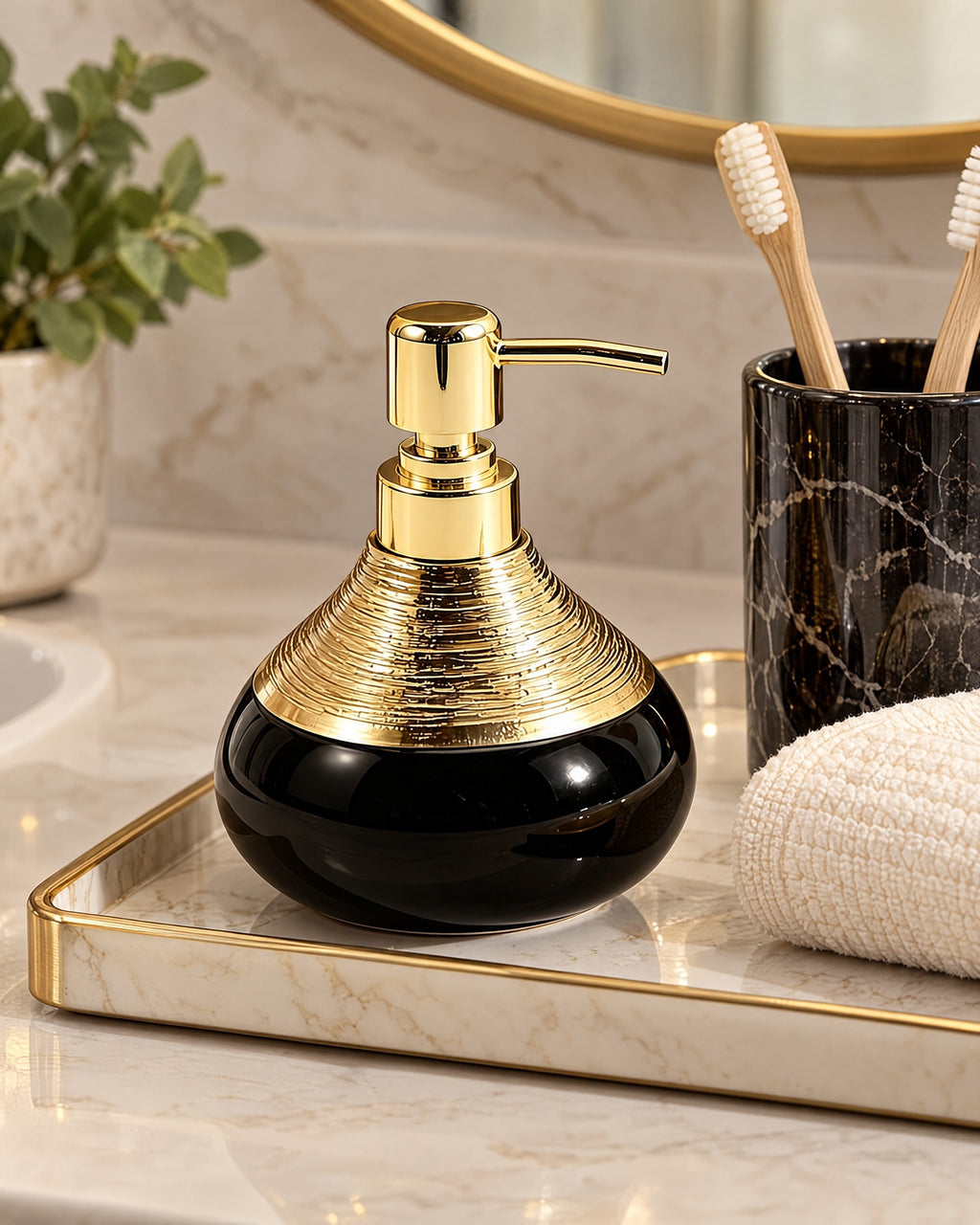 Soap Dispenser, Ceramic, Black with Brushed Gold, 9 oz styled on a tray with bathroom accessories