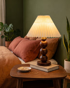 Bobbin Trio Wood Nightstand Lamp with olive and terracotta mid-century bedding