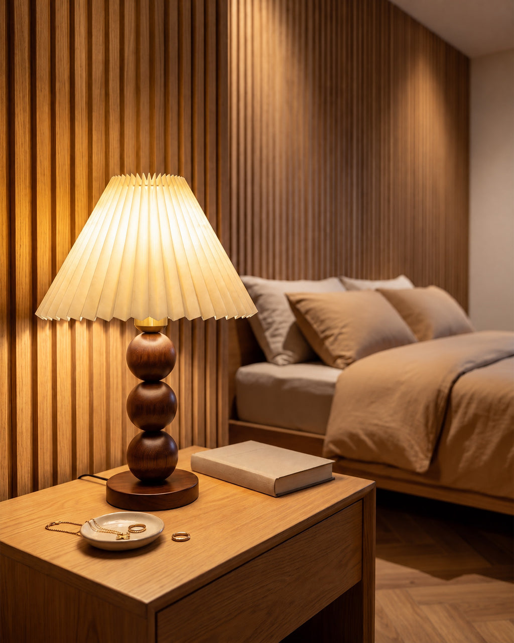 Bobbin Trio Wood Nightstand Lamp beside a wood slat feature wall