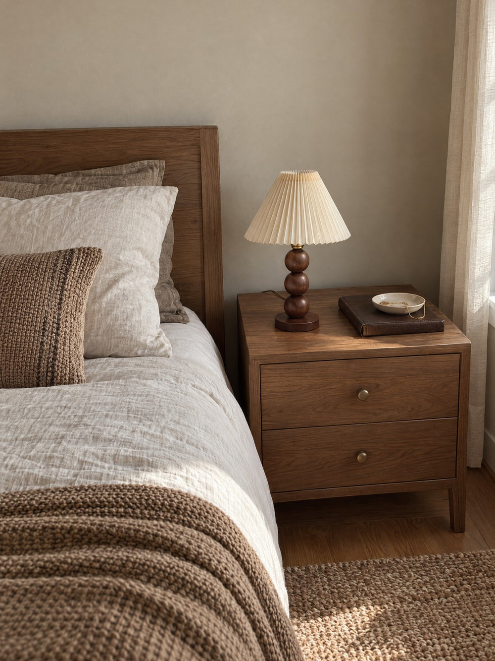Bobbin Trio Wood Nightstand Lamp on a nightstand in daylight