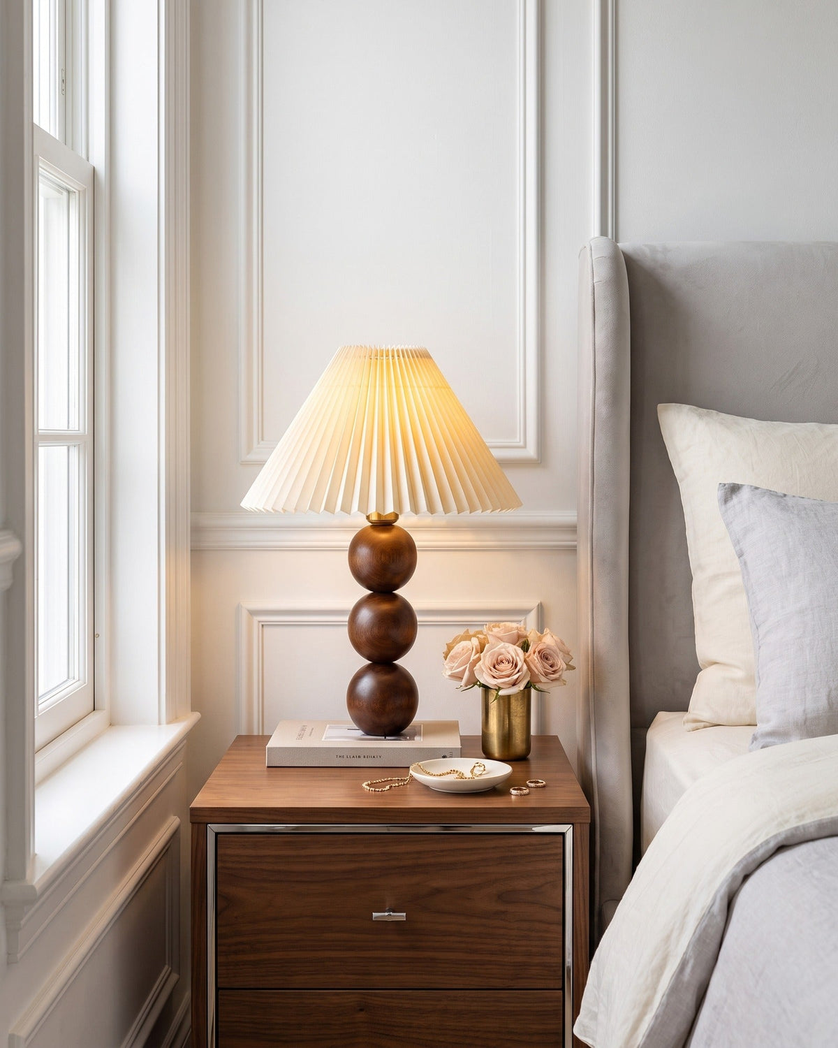 Bobbin Trio Wood Nightstand Lamp on a walnut nightstand in a white panelled bedroom