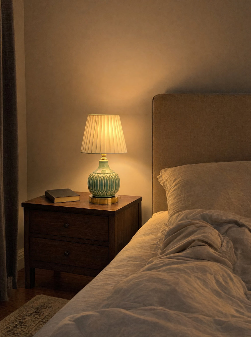 Celadon Carved Gourd Nightstand Lamp, at night on a nightstand
