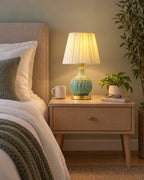 Celadon Carved Gourd Nightstand Lamp in a styled bedroom at dusk