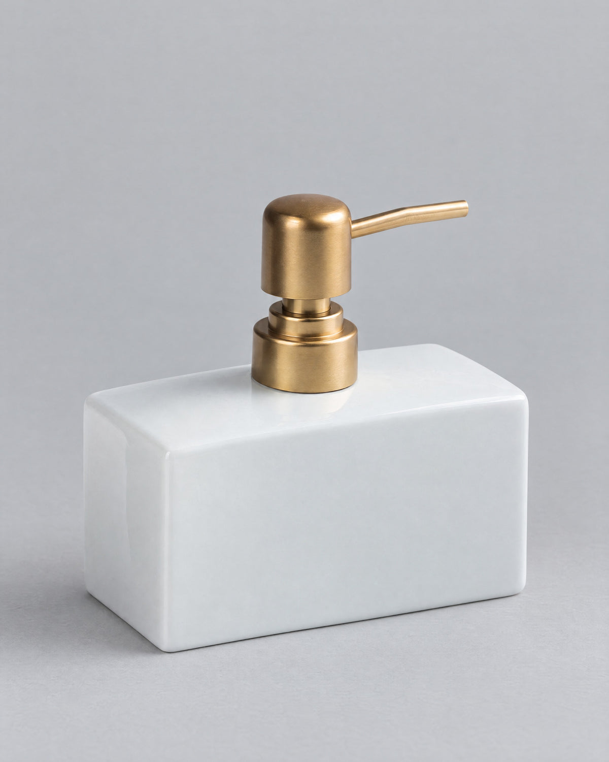 White: Ceramic Soap Dispenser, Rectangular, Gold Pump, 13.5 oz against a seamless studio backdrop