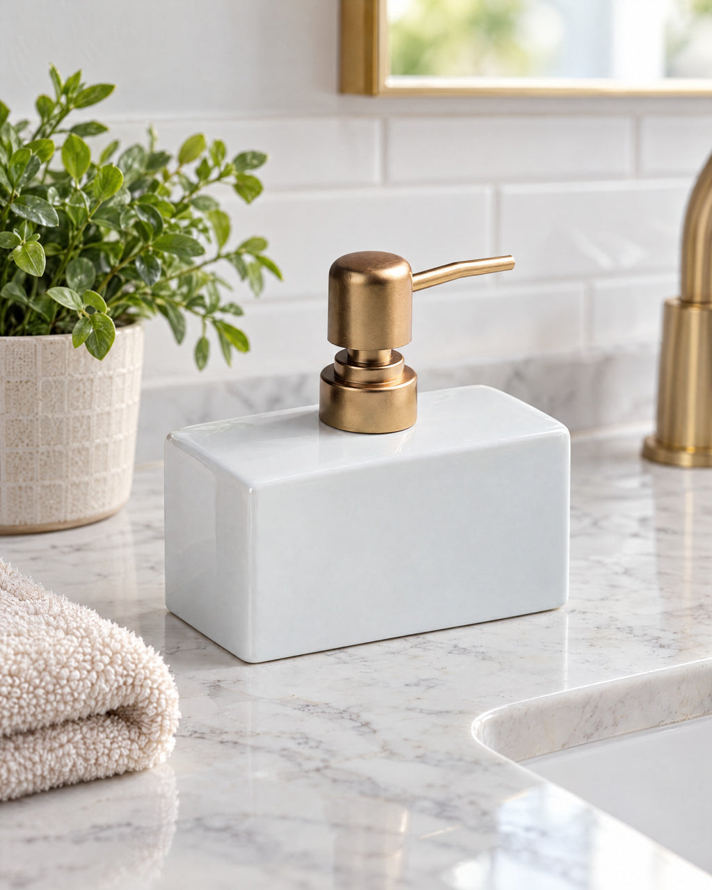 White: Ceramic Soap Dispenser, Rectangular, Gold Pump, 13.5 oz styled on a bathroom counter