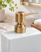 White: Close-up of the glaze and pump finish of the Ceramic Soap Dispenser, Rectangular, Gold Pump, 13.5 oz