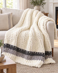 Chunky Knit Throw Blanket, Cream, Washable Feather Yarn draped over a sofa