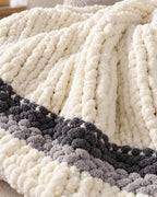Close-up of the texture of the Chunky Knit Throw Blanket, Cream, Washable Feather Yarn