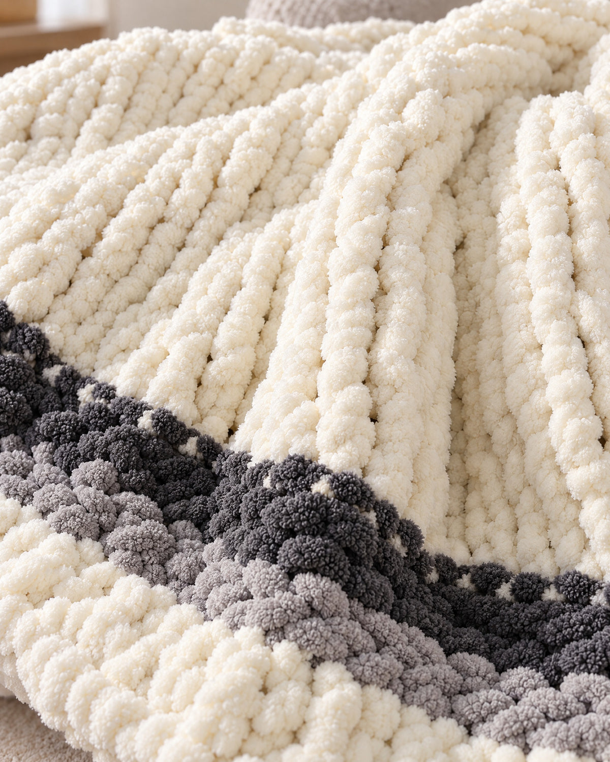 Close-up of the texture of the Chunky Knit Throw Blanket, Cream, Washable Feather Yarn