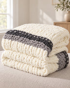 Chunky Knit Throw Blanket, Cream, Washable Feather Yarn folded into a stack, showing its thickness