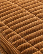 Golden Amber: Close-up of the fabric of the Cozy Quilted Couch Cover Protector
