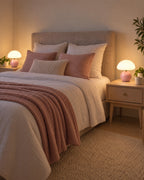 Pink: Two Dolce Mushroom Nightstand Lamp lamps in pink flanking a bed at night
