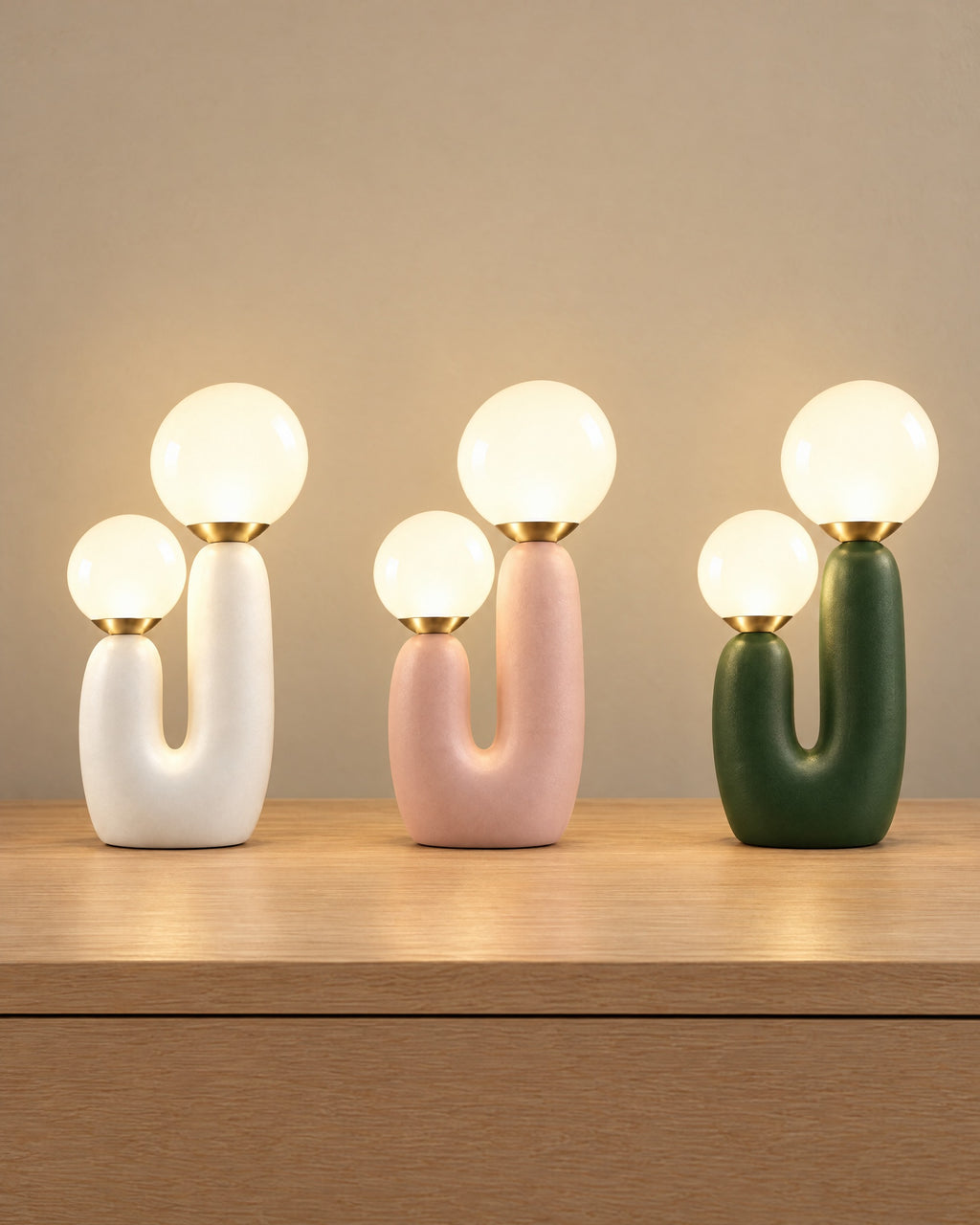 All colourways of the Duo Globe Sculptural Nightstand Lamp side by side: White, Pink, Green