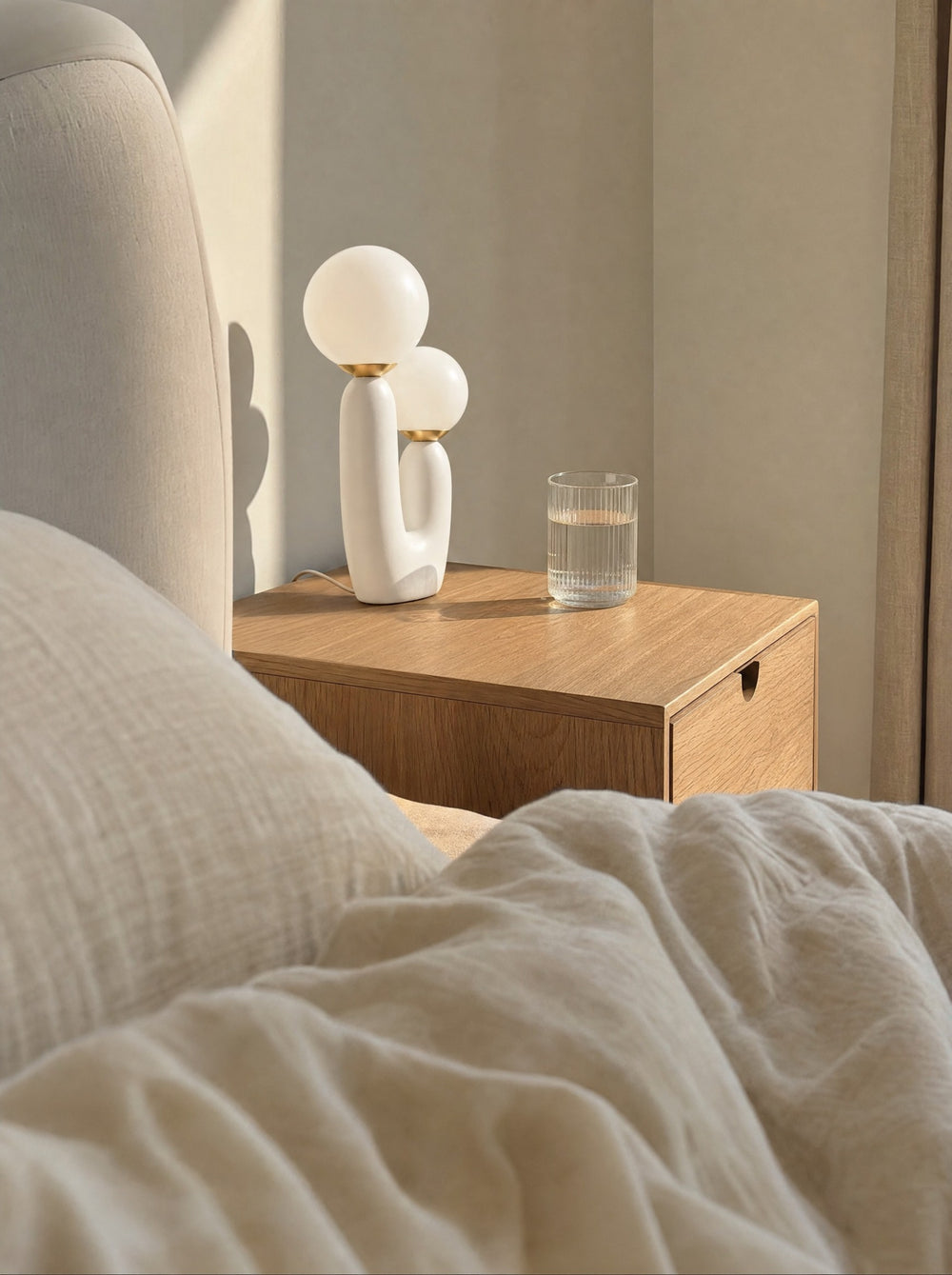 Duo Globe Sculptural Nightstand Lamp, seen from the bed in the morning