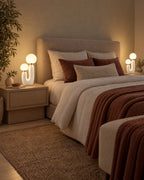 White: Two Duo Globe Sculptural Nightstand Lamp lamps flanking a bed at night
