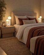 Two Duo Globe Sculptural Nightstand Lamp lamps flanking a bed at night