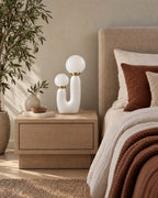 White: Duo Globe Sculptural Nightstand Lamp switched off in soft morning daylight