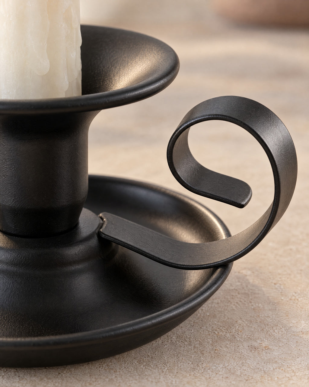 Close-up of the material and finish of the Tazza Iron Teacup Candle Holder