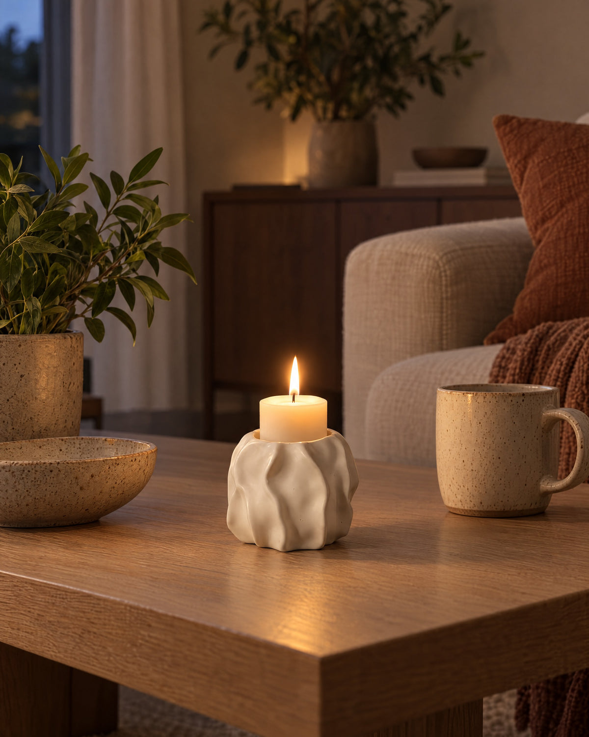 Low & Wide: Wave Abstract Ceramic Candle Holder styled in a warm interior at dusk