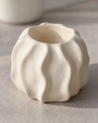 Low & Wide: Close-up of the material and finish of the Wave Abstract Ceramic Candle Holder