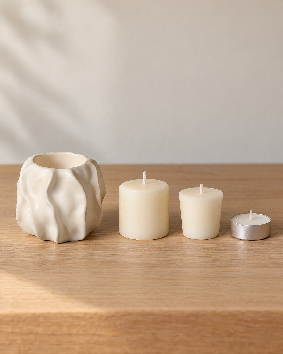 Low & Wide: Wave Abstract Ceramic Candle Holder with the candle type that fits, shown beside it