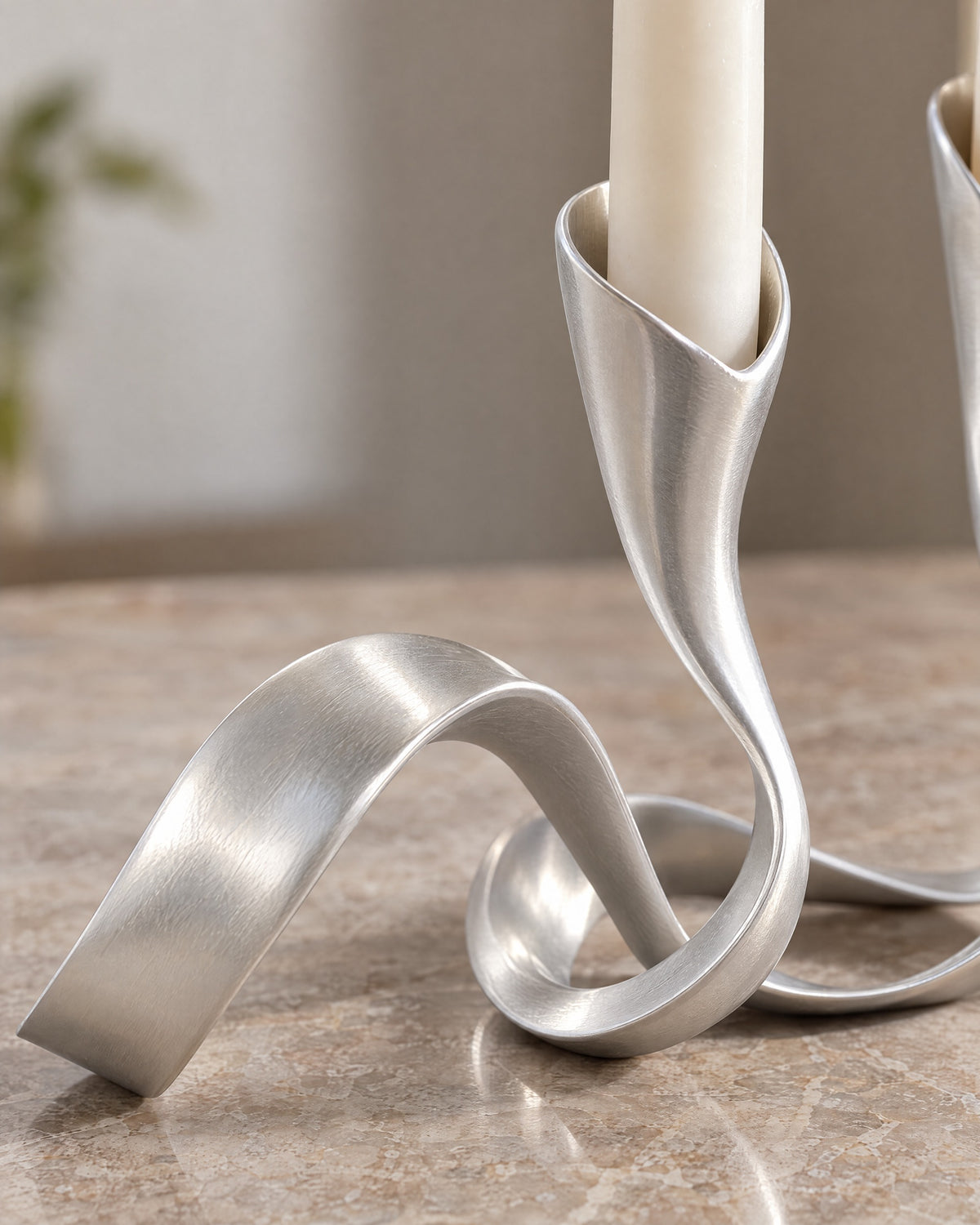 Silver: Close-up of the material and finish of the Ribbon Metal Candelabra