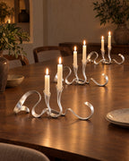 Silver: Ribbon Metal Candelabra, three styled together with lit candles