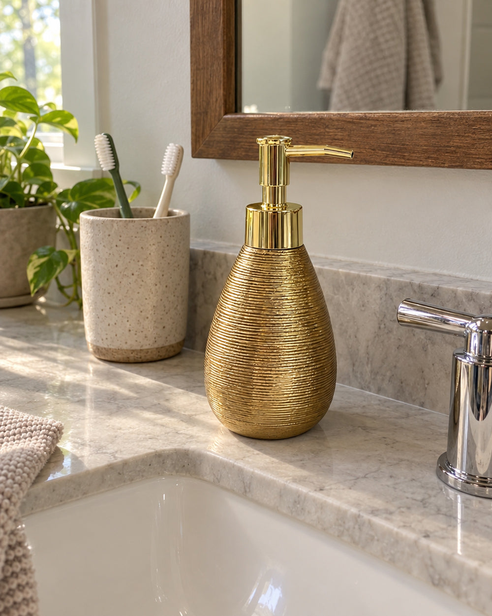 Teardrop Soap Dispenser, Ceramic, Brushed Gold in a real home
