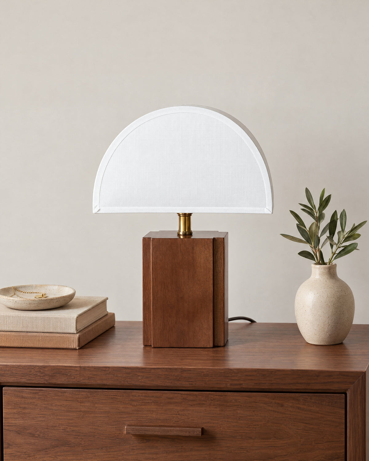 White Trim: Halvo Half Dome Walnut Nightstand Lamp in walnut / white trim on a nightstand top against a light studio backdrop
