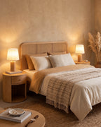 Pair of Linnea oak nightstand lamps on both sides of a rattan bed