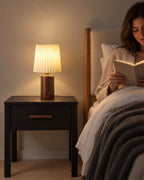 Walnut: Linnea Pleated Wood Nightstand Lamp in walnut as a reading light beside the bed