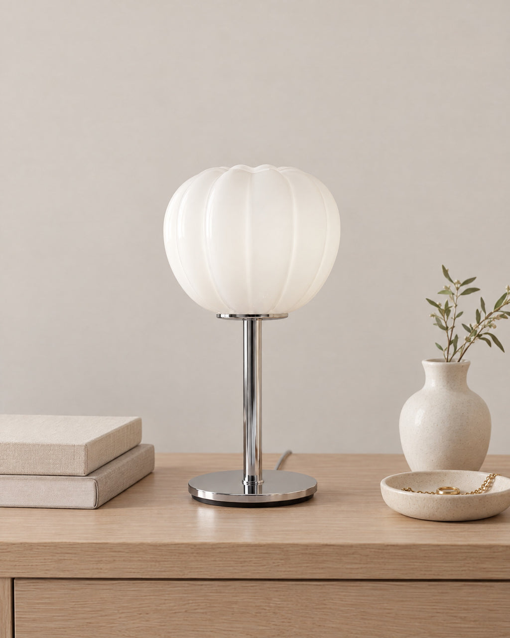 Luna Ribbed Opal Glass Nightstand Lamp on a nightstand top against a plain backdrop