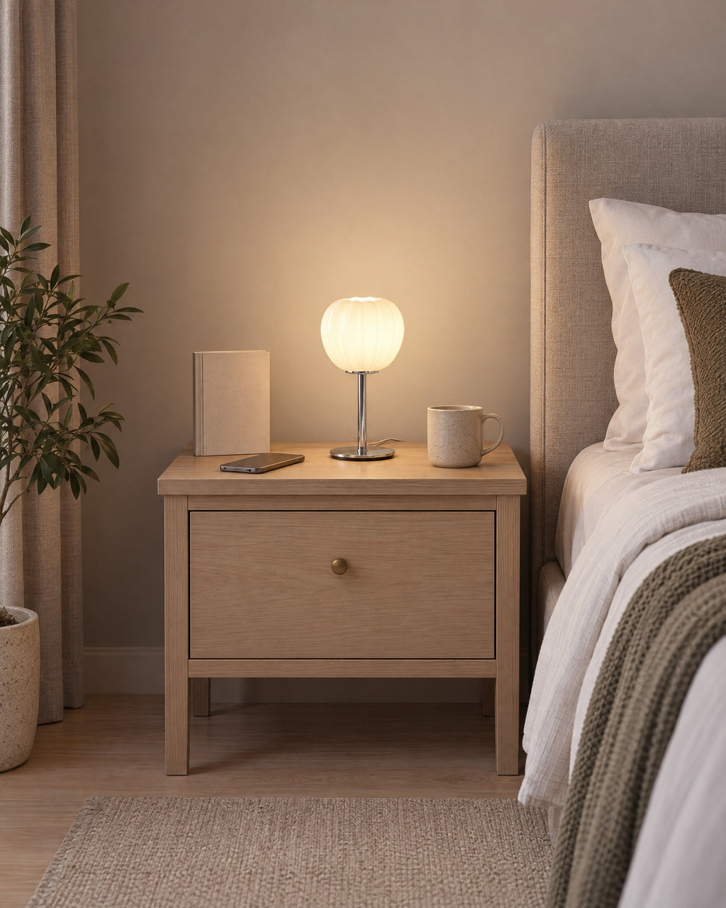 Luna Ribbed Opal Glass Nightstand Lamp on a standard nightstand, showing its true size