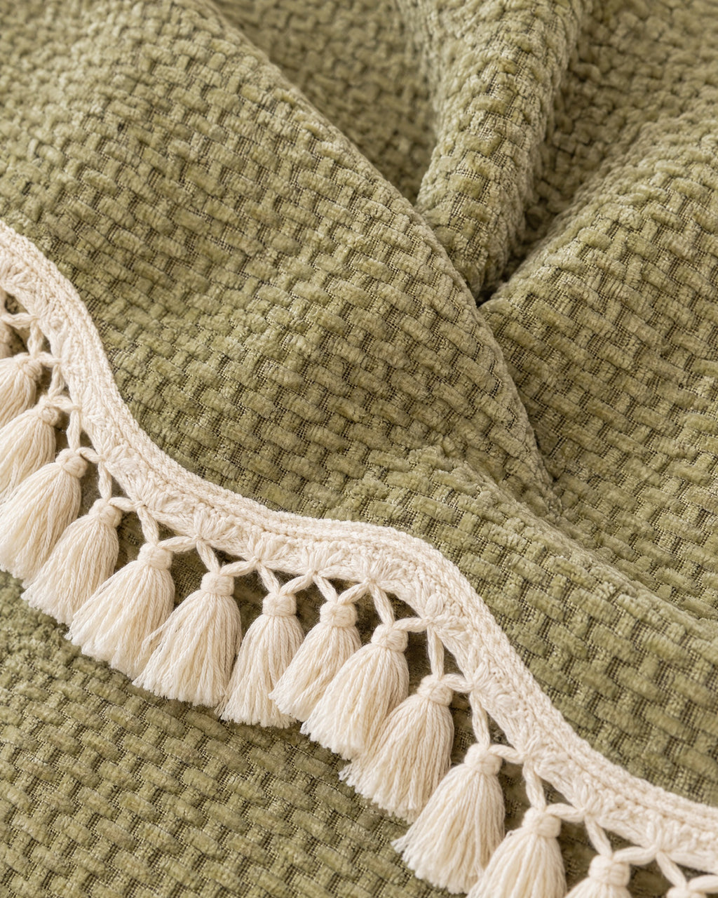 Olive Charm: Close-up of the fabric of the Luxury Chenille Woven Texture Tassel Sofa Cover