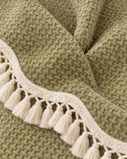 Olive Charm: Close-up of the fabric of the Luxury Chenille Woven Texture Tassel Sofa Cover
