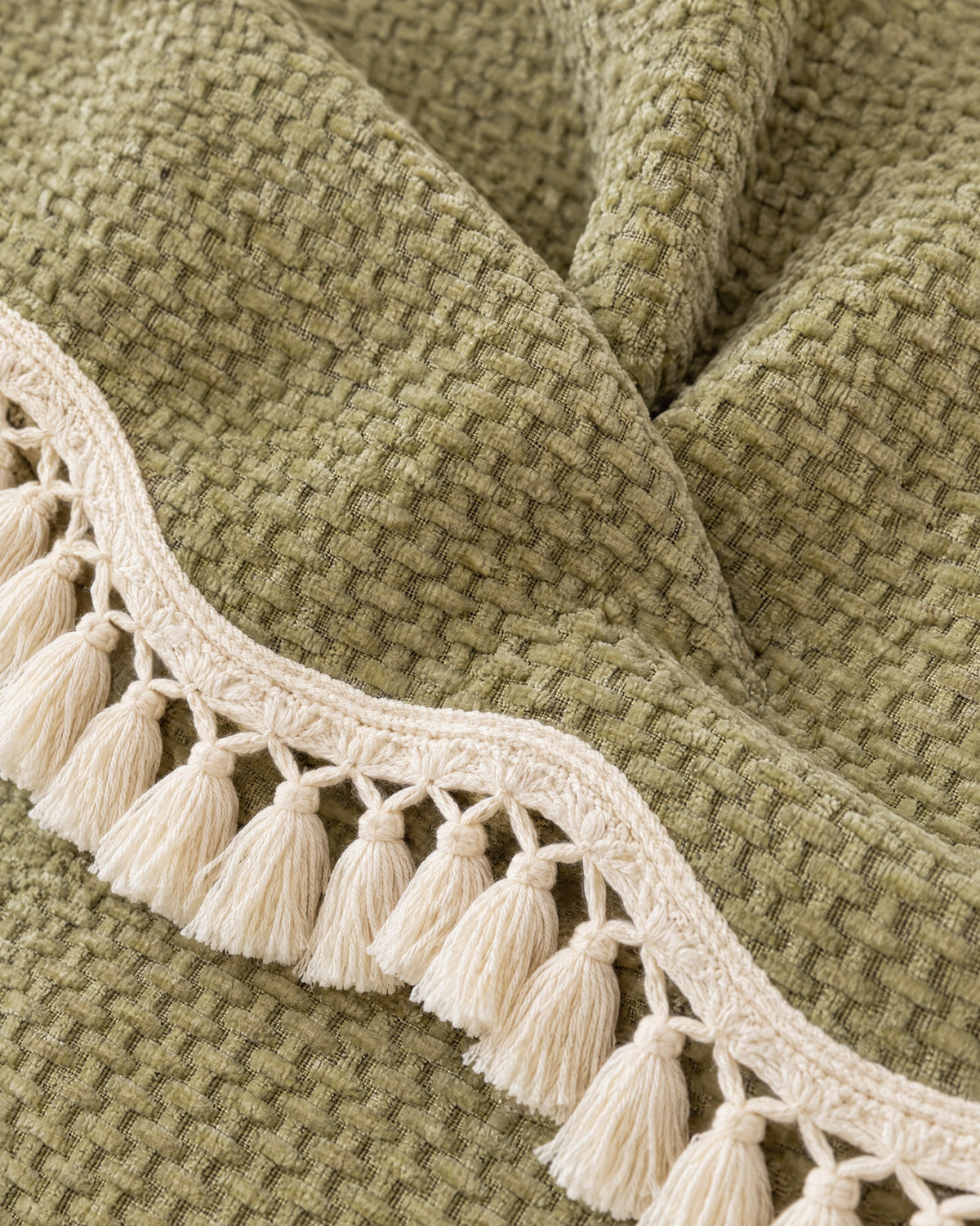 Olive Charm: Close-up of the fabric of the Luxury Chenille Woven Texture Tassel Sofa Cover