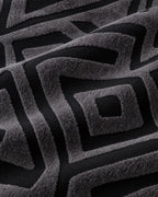 Charcoal Black: Close-up of the fabric of the Luxury Urban Maze Sofa Cover