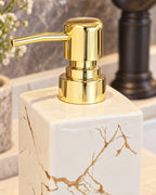 White: Close-up of the glaze and pump finish of the Marble Soap Dispenser, Square Ceramic, Gold Pump